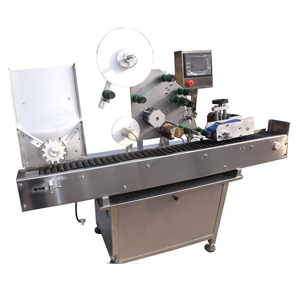 Etiketovací stroj s kulatou lahvičkou a štítkem s točnou